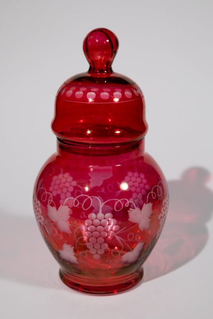 Vintage decorative bottle with vine pattern